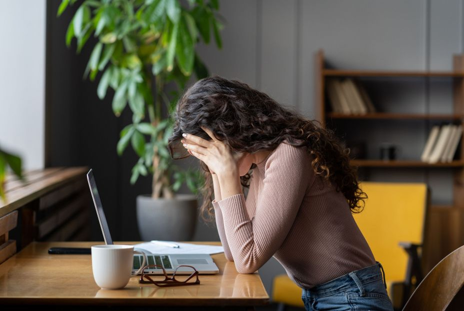 bigstock Exhausted Upset Woman Sit At D 444121277