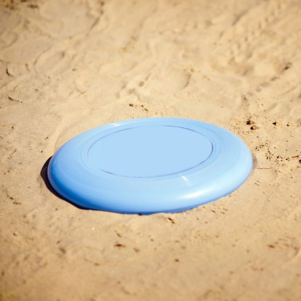 bigstock Frisbee Lying In Sand 46052251