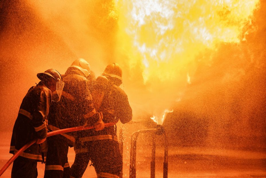 bigstock Firefighter Using Extinguisher 404119025