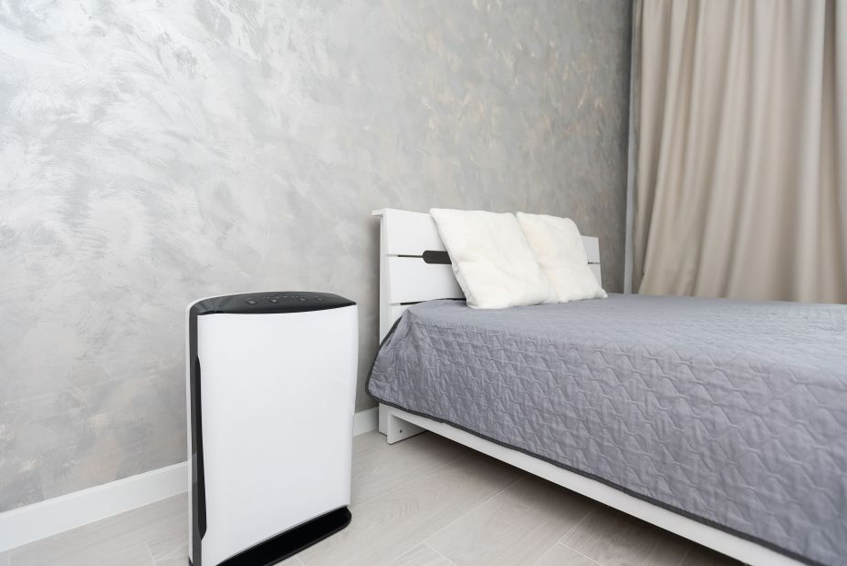 bigstock Air Purifier In Cozy White Bed 449602147