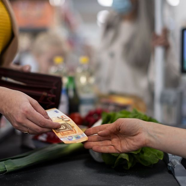 bigstock Close up Of Woman Giving Money 455222203