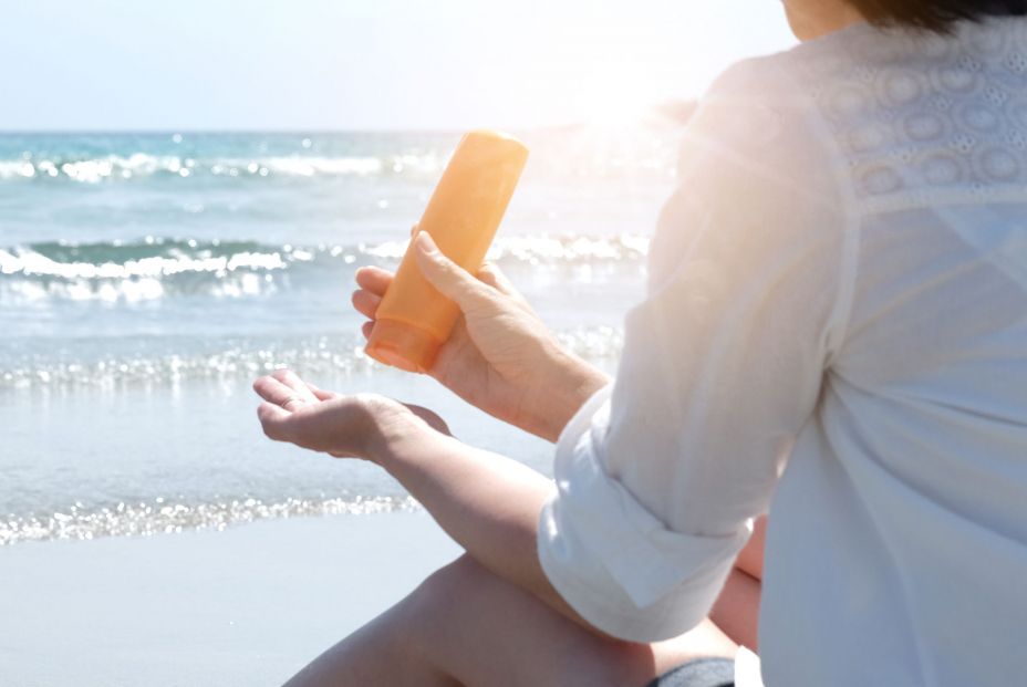 bigstock Hand Of Female Holding Sunscre 473482371