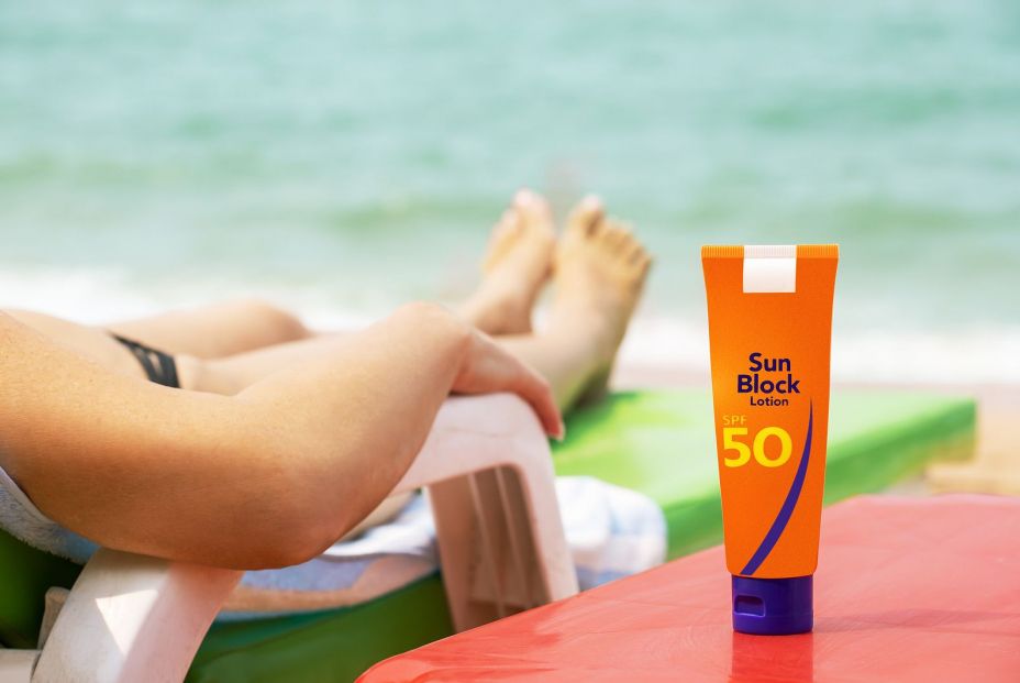 bigstock Sunscreen On The Beach Early  475855883