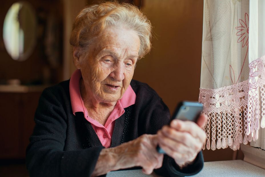 bigstock An old woman uses a smart phon 182287285