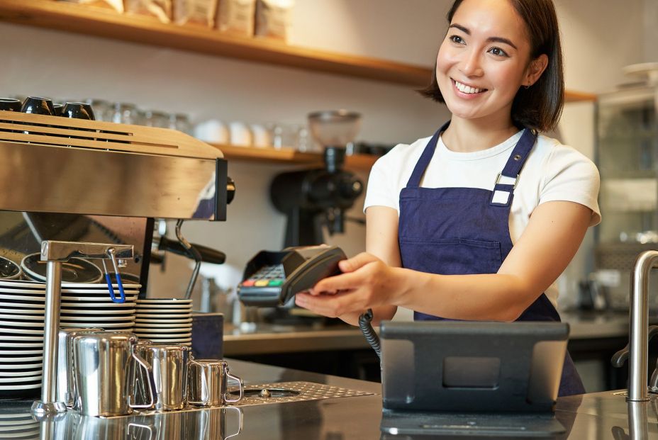 bigstock Smiling Asian Girl Barista Gi 467341319