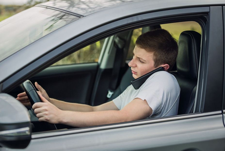 bigstock Young Guy Unsafe Driving While 466282103