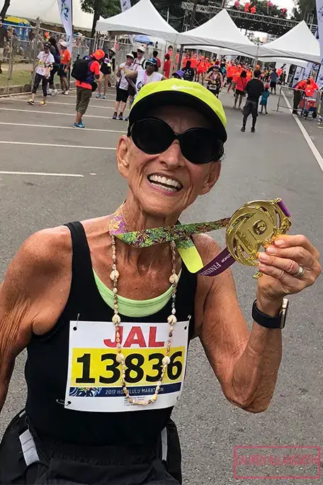 mathea allansmith holding her marathon medal tcm25 756248