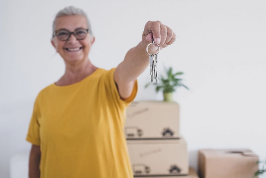 bigstock Senior Happy Woman Holding Key 460957193