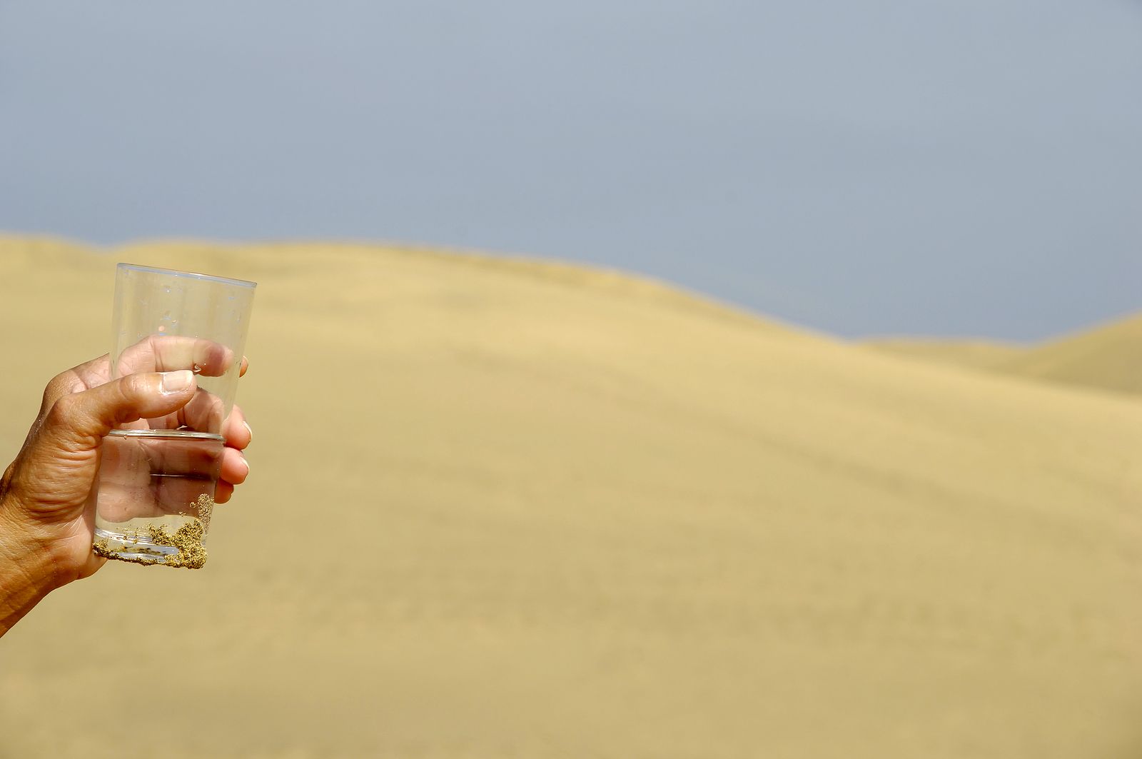 bigstock Hand And Fresh Water In Desert 1947984