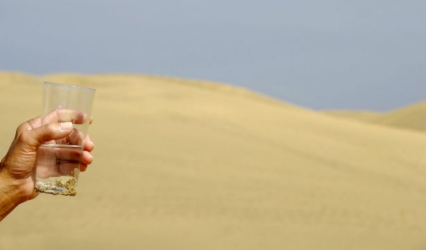 bigstock Hand And Fresh Water In Desert 1947984