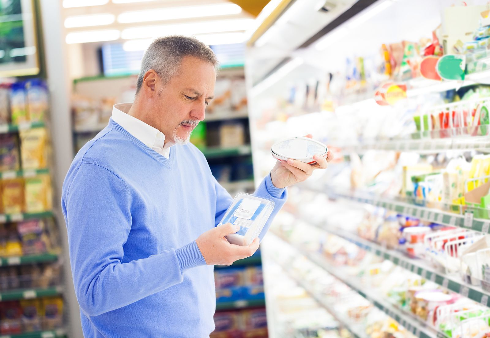 bigstock Man comparing products at the 39958069 bigstock Man comparing products at the 39958069