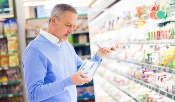 bigstock Man comparing products at the  39958069
