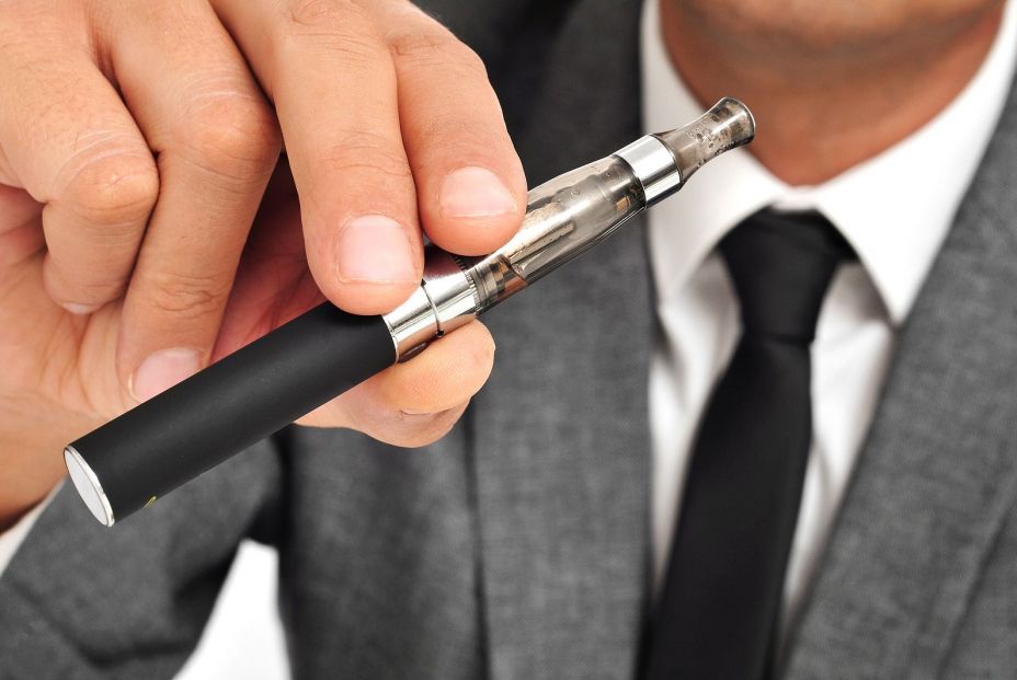 bigstock man wearing a suit vaping with 52117903 bigstock man wearing a suit vaping with 52117903