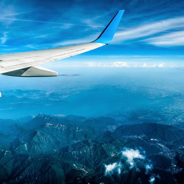 bigstock Wing Of Airplane Flying Above 318723424 bigstock Wing Of Airplane Flying Above 318723424