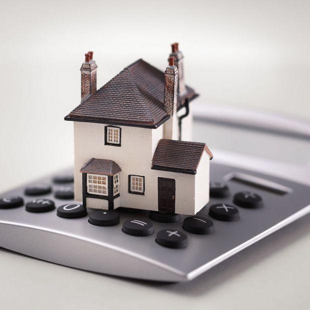 bigstock House resting on calculator co 82188245