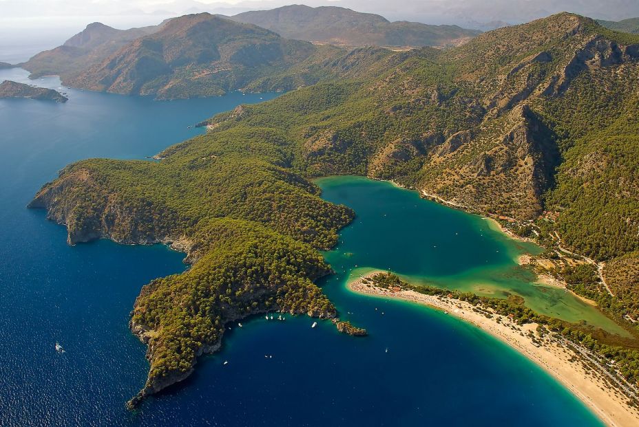 bigstock Paragliding over turquoise bay 25888244 bigstock Paragliding over turquoise bay 25888244