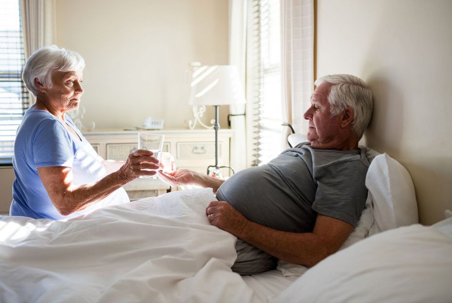 bigstock Senior woman giving medicine t 184513252