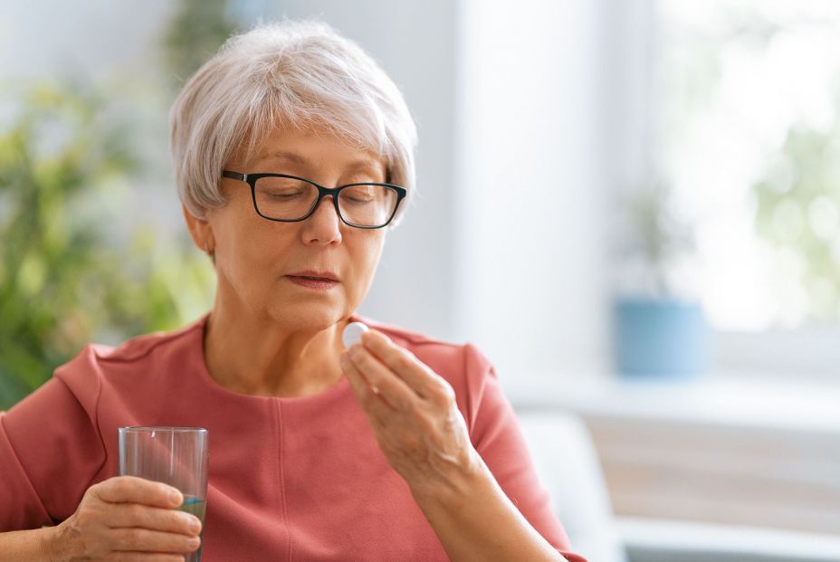 bigstock Senior woman holding pill and 387235927 bigstock Senior woman holding pill and 387235927