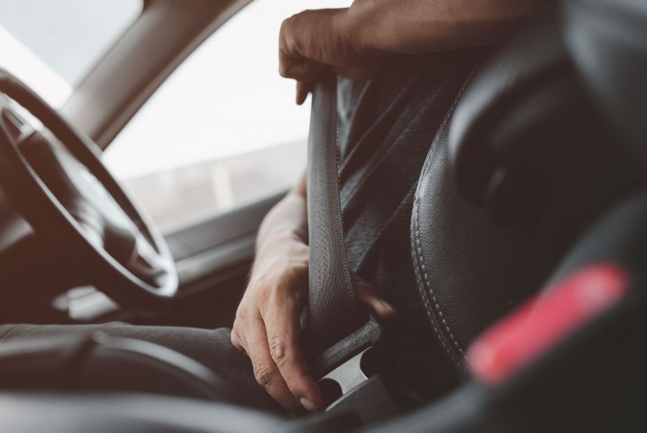 bigstock Male Hand Fastens The Seat Bel 412367881