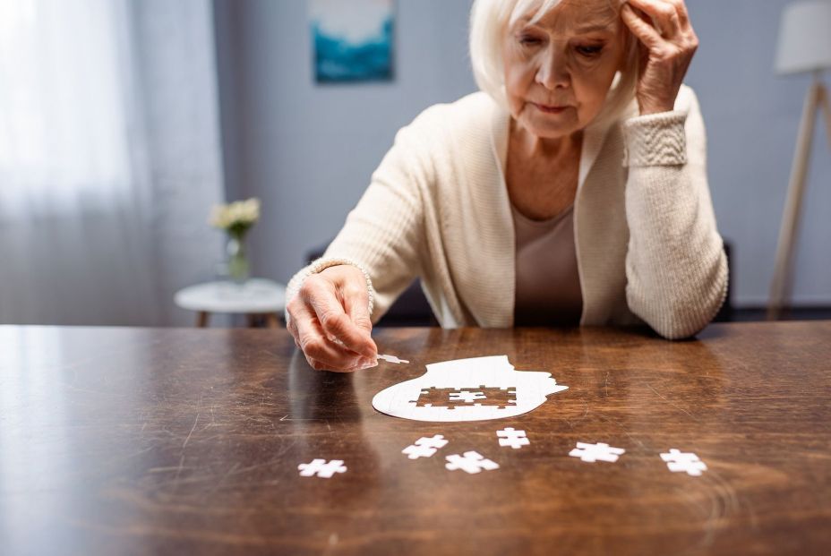 bigstock senior woman combining jigsaw 376542547 bigstock senior woman combining jigsaw 376542547