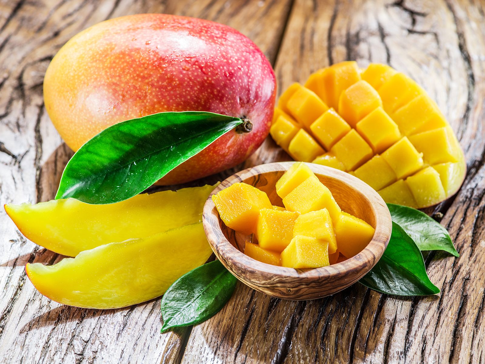 bigstock Mango fruit and mango cubes on 122875289 bigstock Mango fruit and mango cubes on 122875289