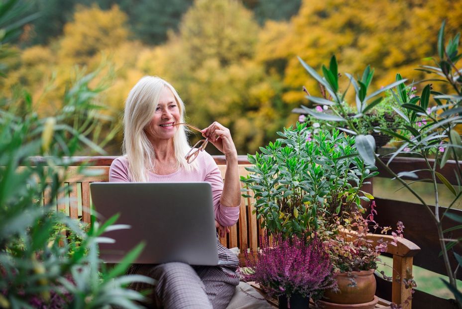 bigstock Senior Woman With Laptop Sitti 351459560