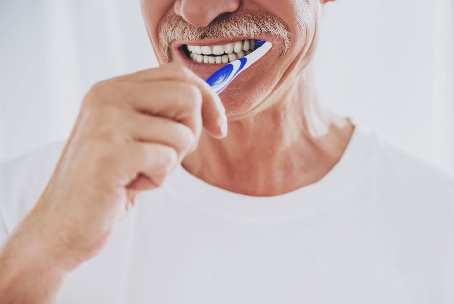 bigstock Close Up Senior Man Brushing  253635082