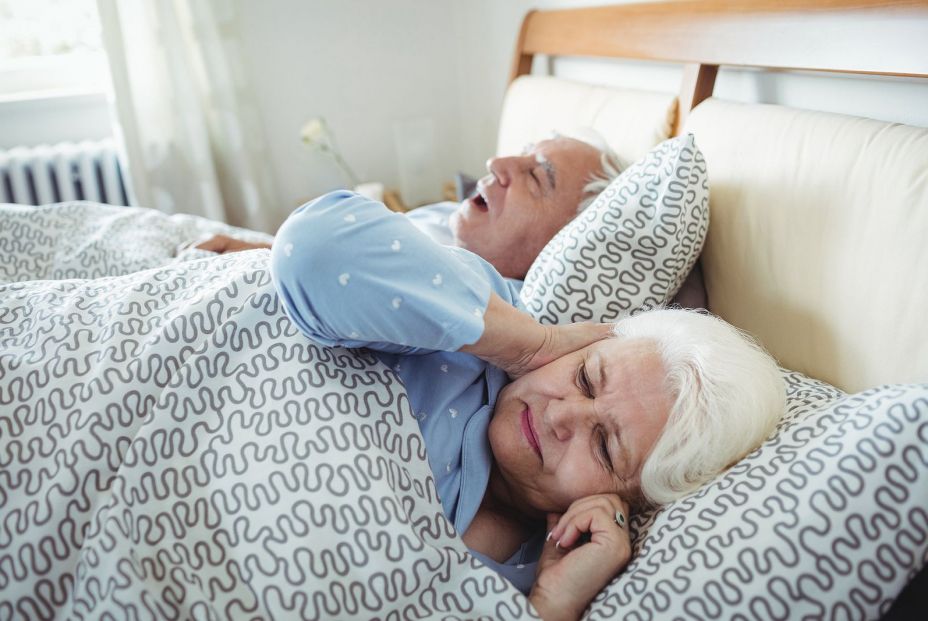 bigstock Man snoring and woman covering 156076622