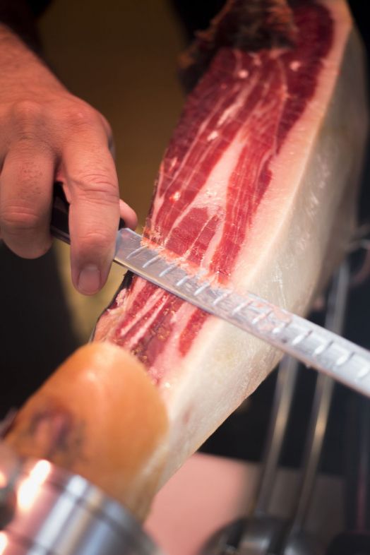 bigstock Cutting Leg Of Iberian Cured H 93124865 bigstock Cutting Leg Of Iberian Cured H 93124865