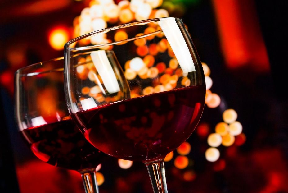 bigstock Two Red Wine Glass Against Chr 75950189