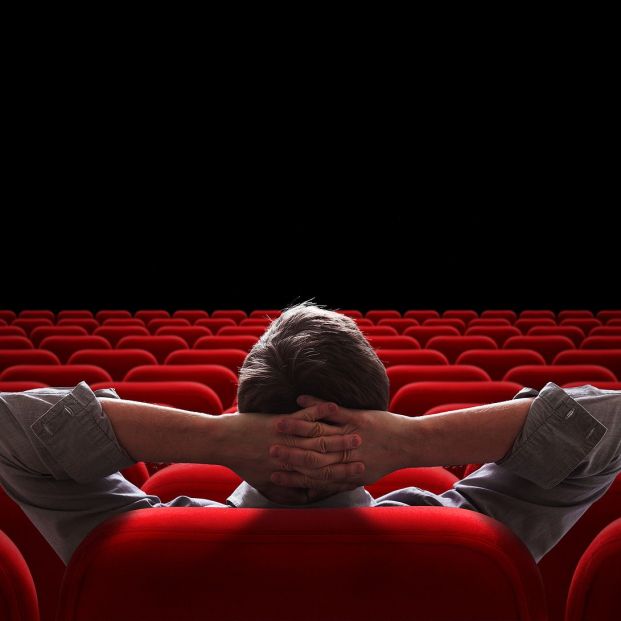 bigstock one man sitting in empty cinem 61719518