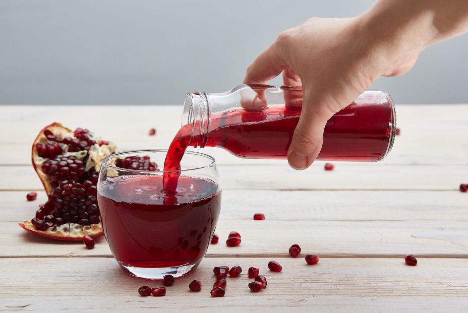 bigstock Hand Pours Pomegranate Juice F 340792819 bigstock Hand Pours Pomegranate Juice F 340792819