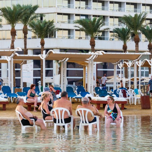 bigstock People Enjoying The Dead Sea A 359474704