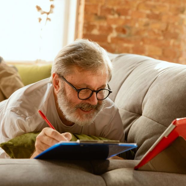 bigstock Senior Man Working With Tablet 324055246