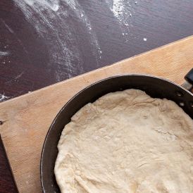 bigstock A Frying Pan With Dough Standi 359465830
