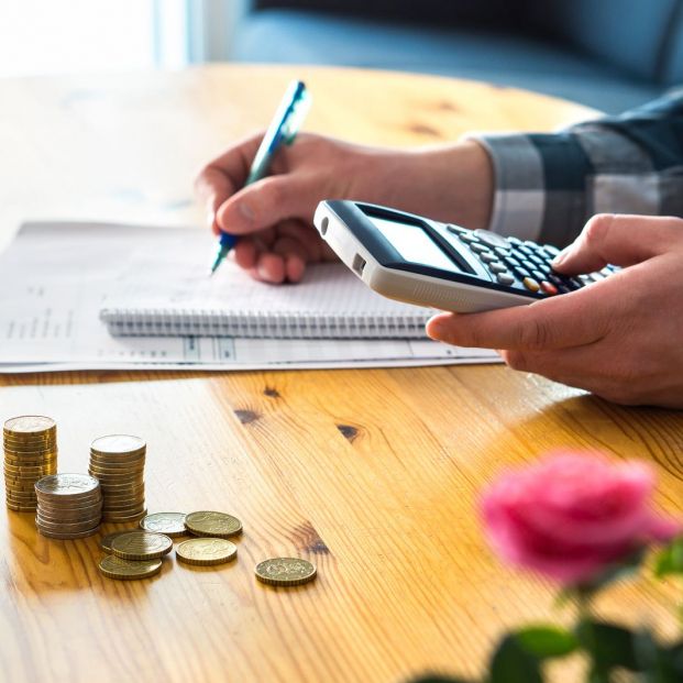 bigstock Man Using Calculator And Count 232467673