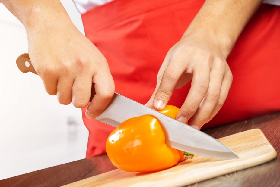bigstock Chef Hands Cutting Orange Fres 360929530