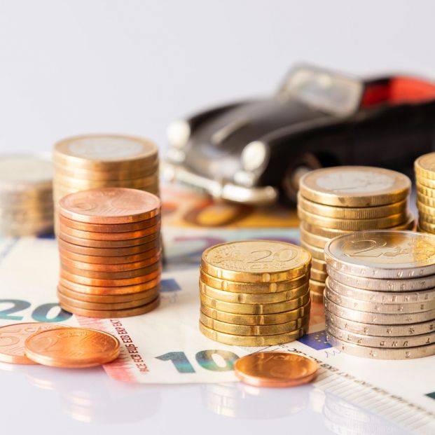 bigstock Stack Of Euro Coins On Euro Ba 345318988