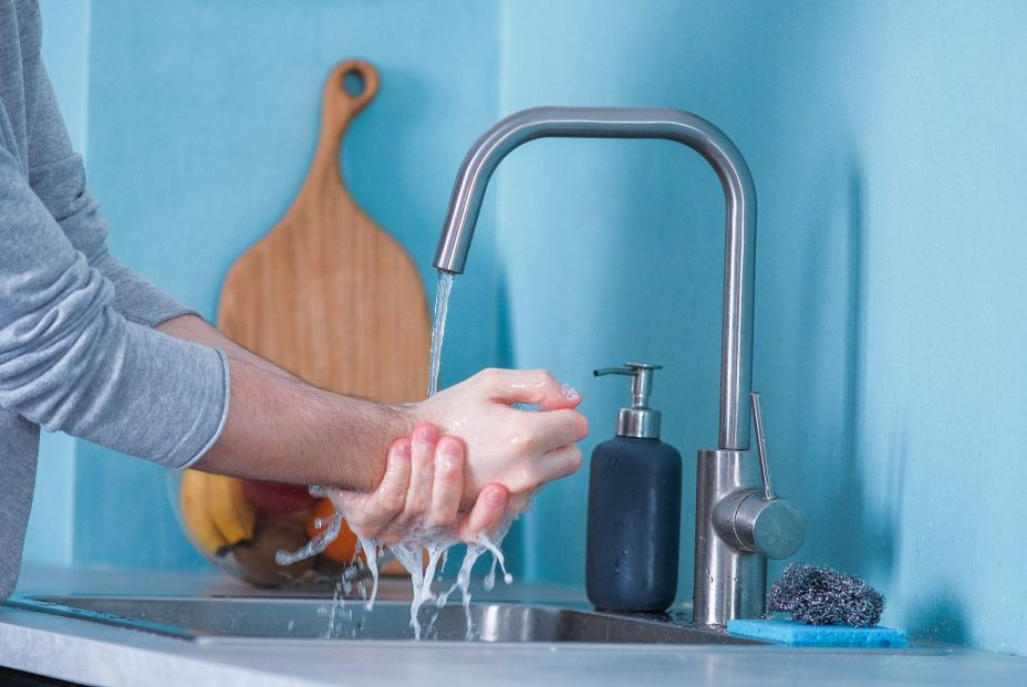 bigstock A Man Washes His Hands Before  357974156