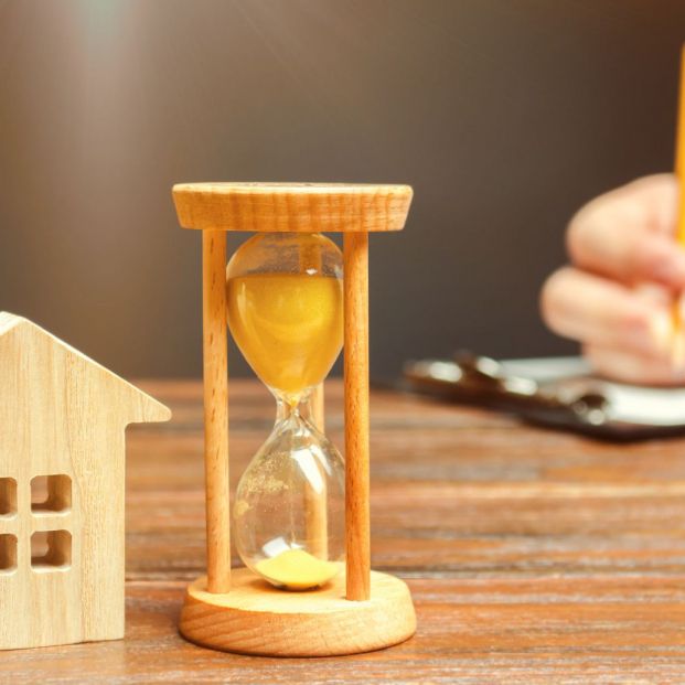 bigstock Wooden House And Clock A Pers 290878687