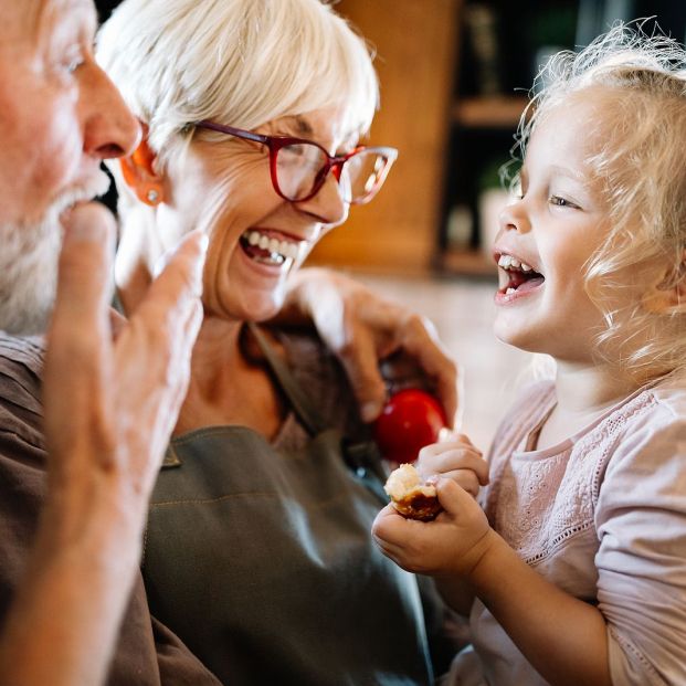 bigstock Happy Grandparents Playing Wit 334690738