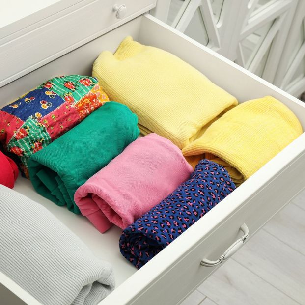 bigstock Folded Clothes In Open Drawer  362057533