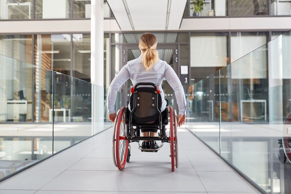 bigstock Paralyzed woman in a wheelchai 340214695