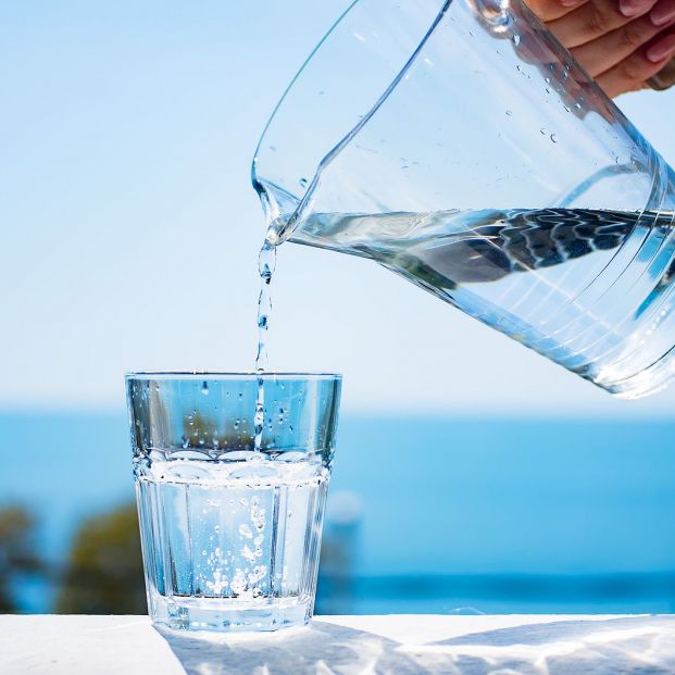 bigstock A Glass Of Water Against The B 254903392