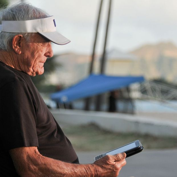 bigstock Elderly man reads ebook on ben 32164286