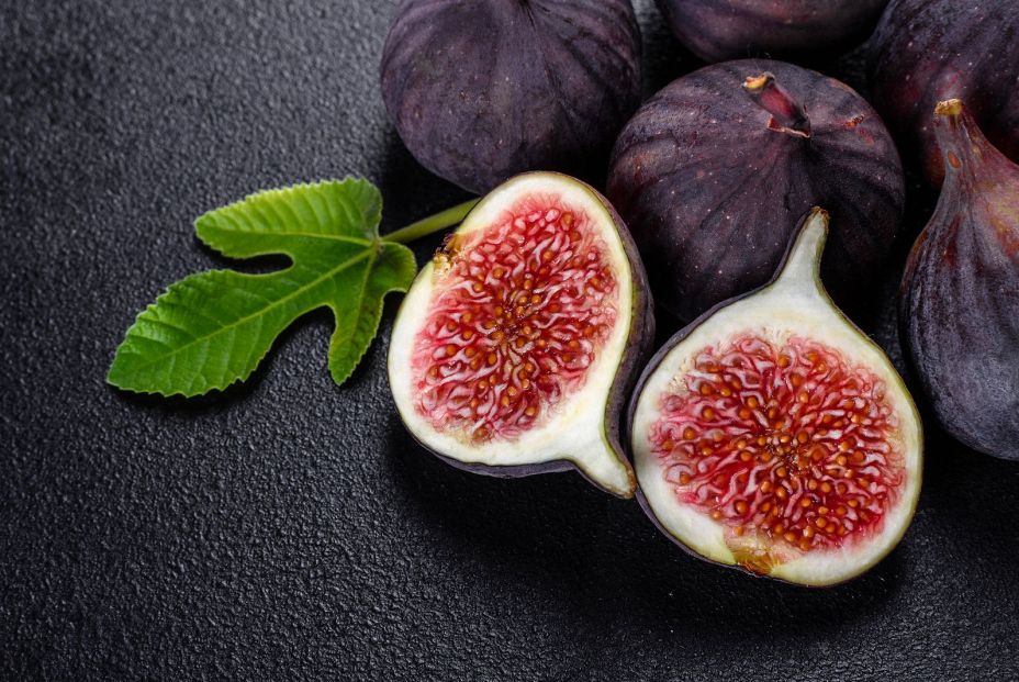 bigstock Fresh Ripe Figs On A Dark Conc 384836393