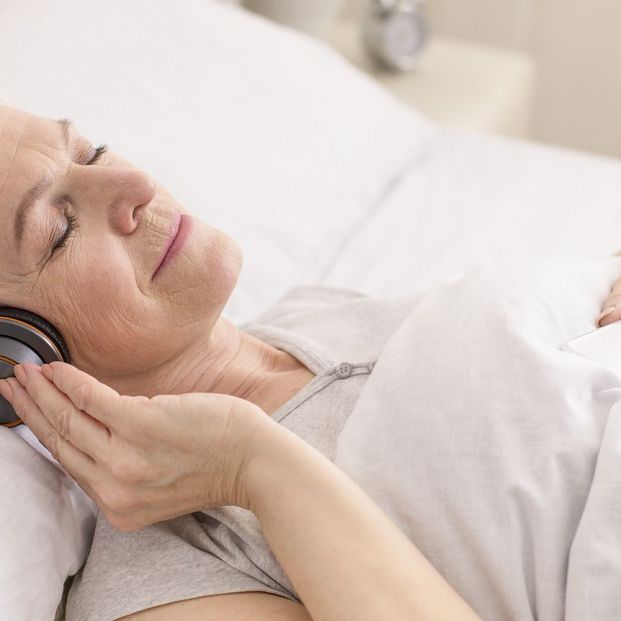 bigstock Calm Senior Woman In Headphone 332055061
