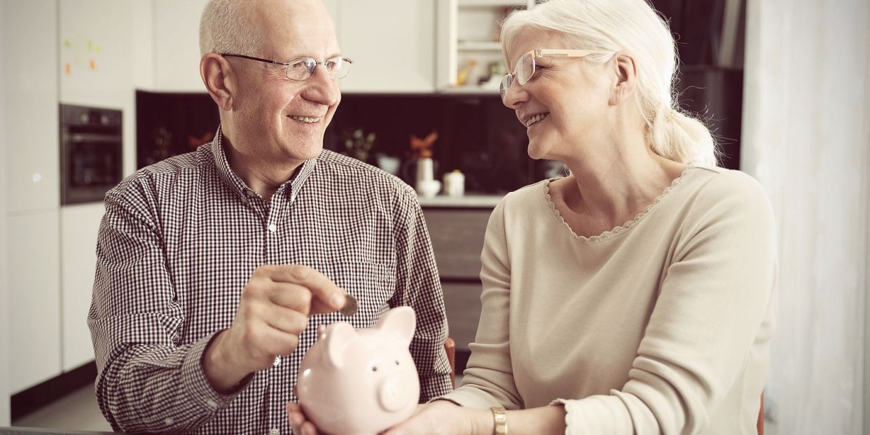 bigstock Senior Couple Puts The Coin In 312902287