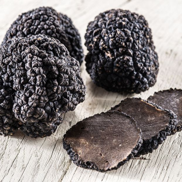 bigstock Black truffles on the old wood 385215941