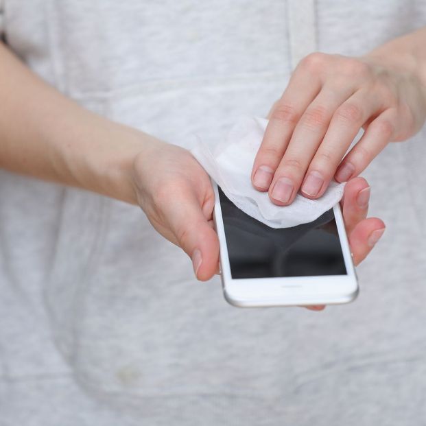 bigstock Person Cleaning Mobile Phone S 360605167